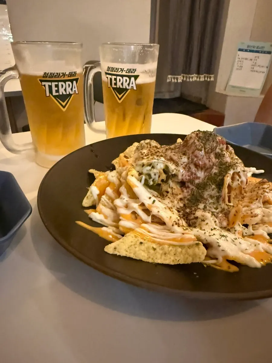 Draft beer ordered with the nachos