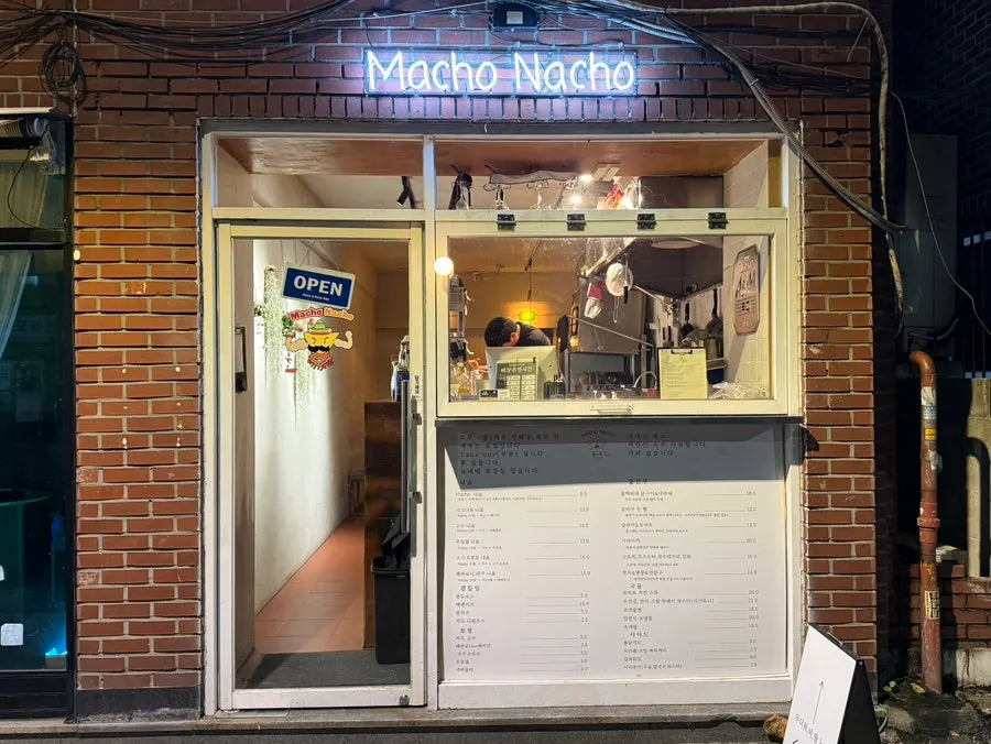 Macho Nacho's entrance and sign in a red brick building