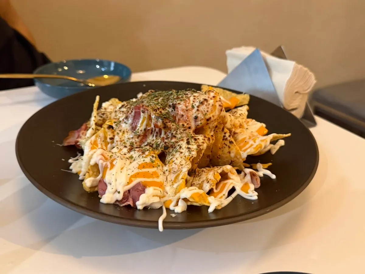 Macho Nacho's signature nachos topped with cheese, bacon, and jalapeños
