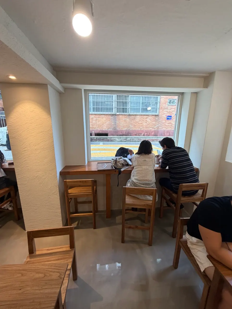 Exterior view in front of the café's glass windows