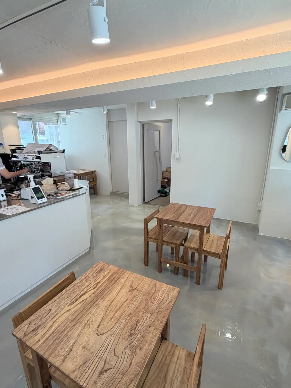 Window seat with a view of the alley through the glass wall
