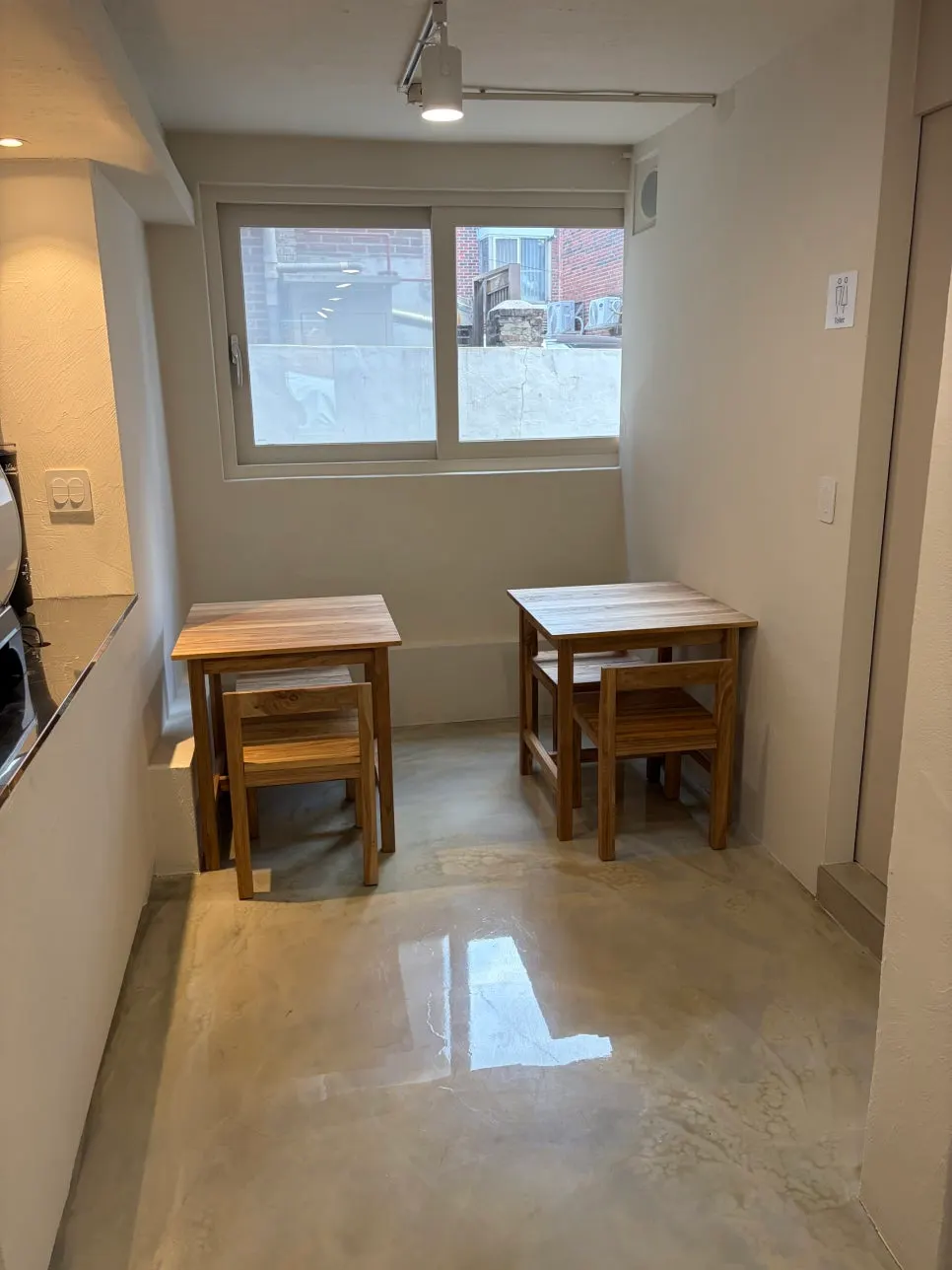 Wooden tables and seats clustered close together