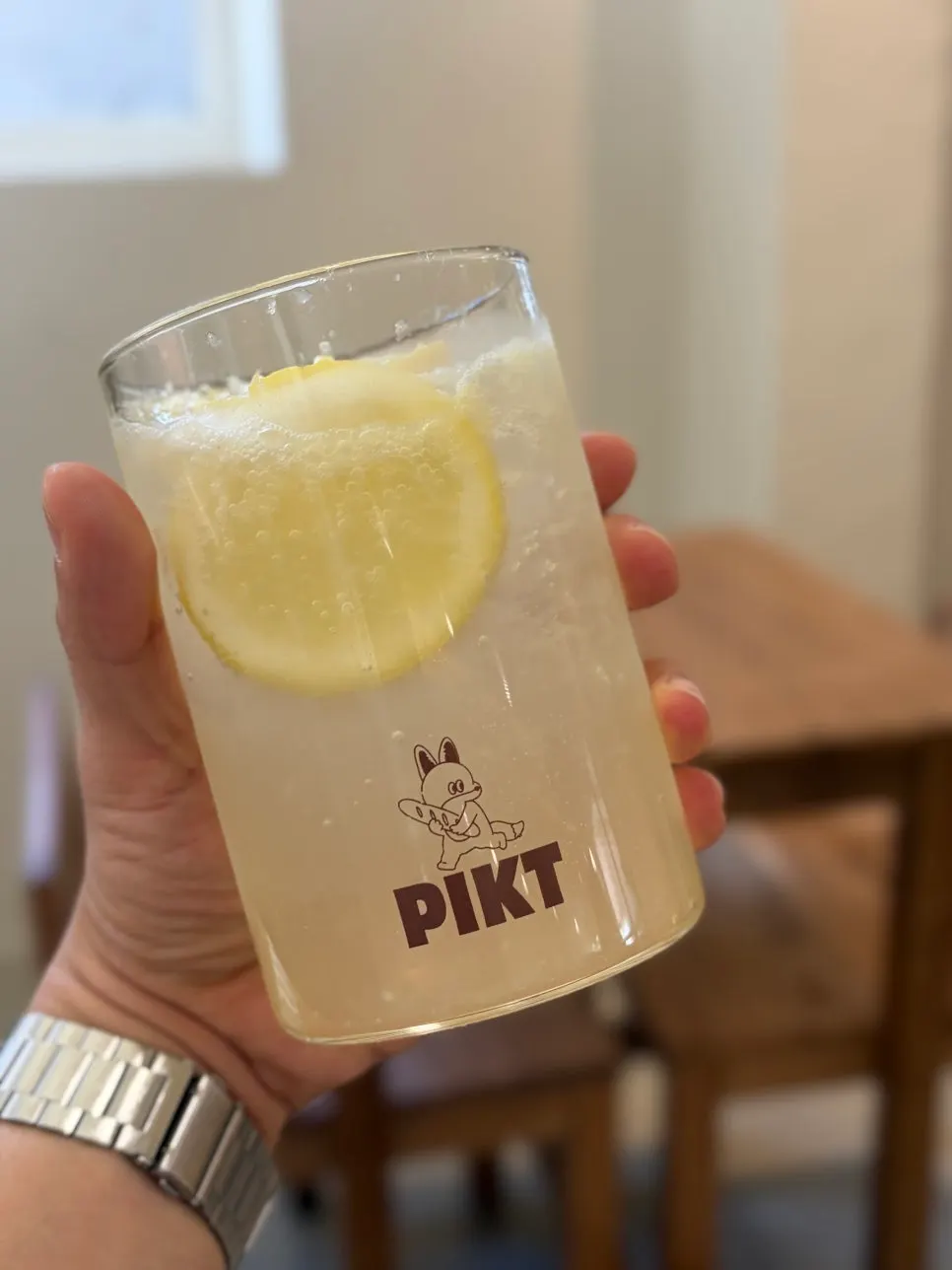 A glass of mint lemonade made with real lemon
