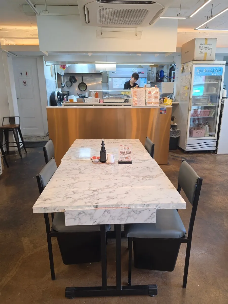 Indoor table seating at Beotkkot Sushi Mangwon