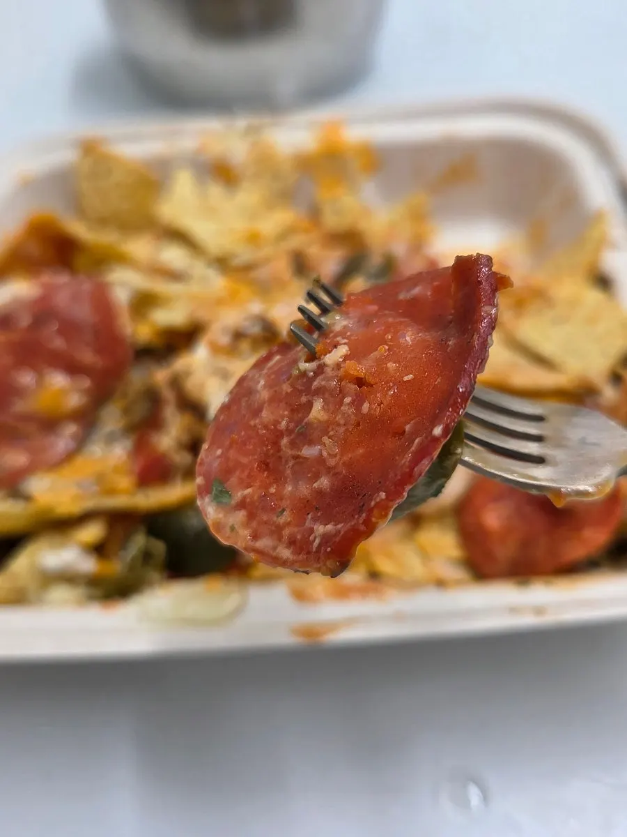 Crispy nacho pieces with stretchy melted cheese