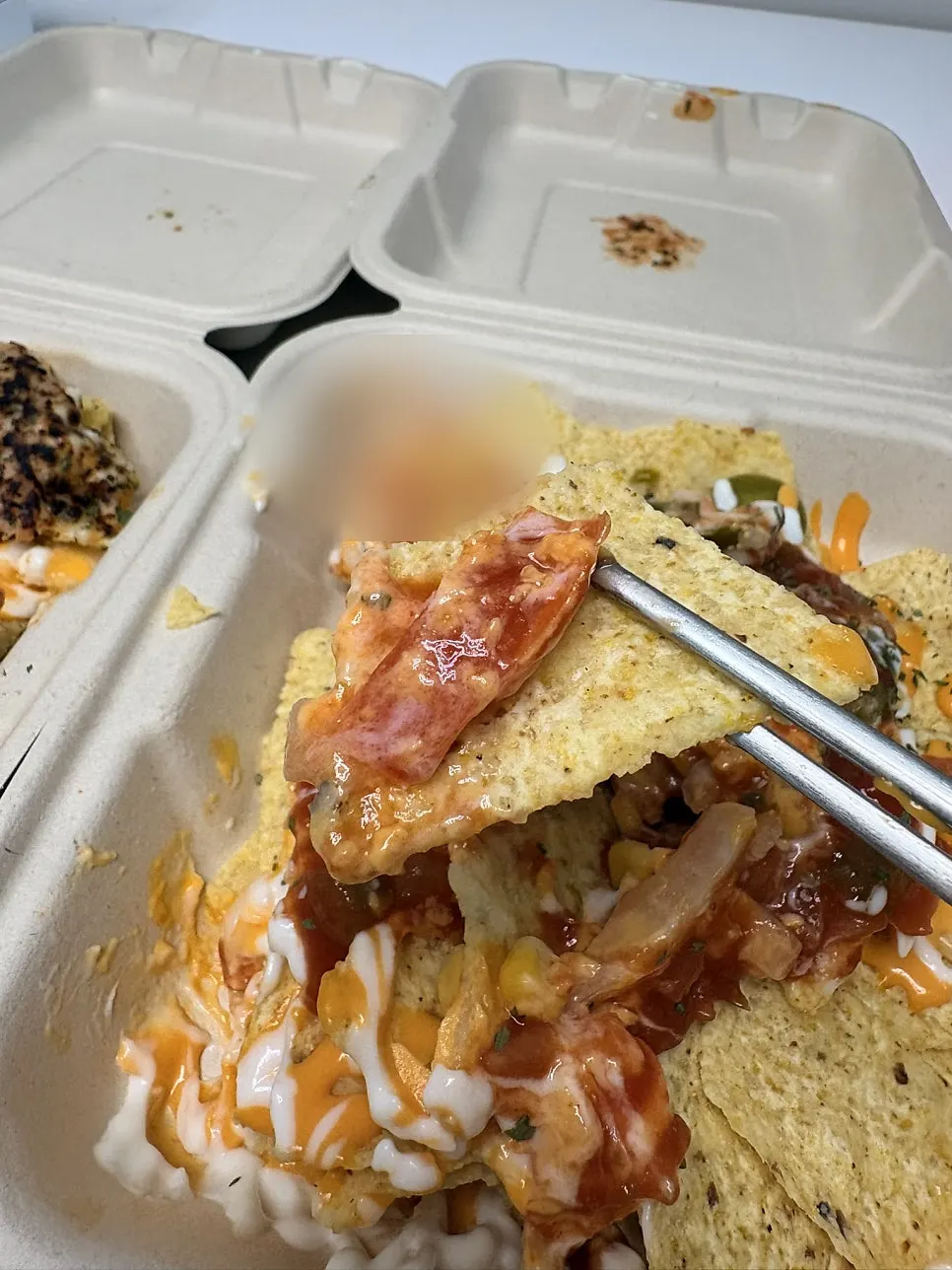 Close-up of crispy nachos and sauce