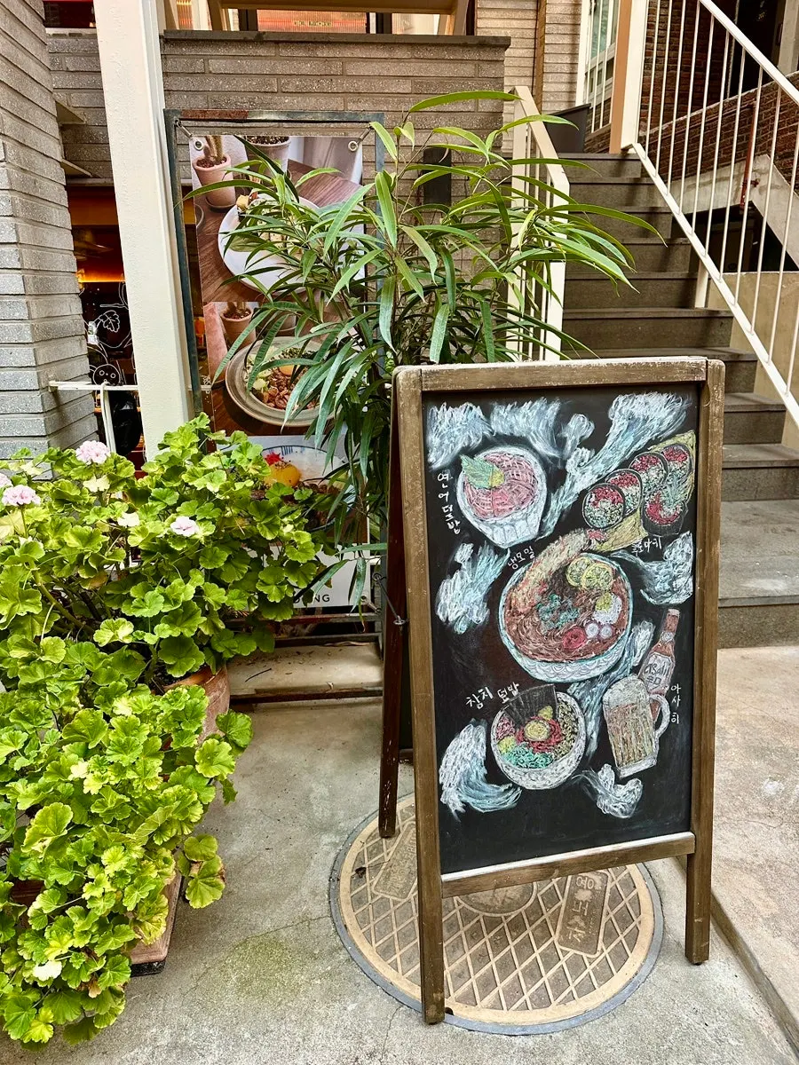 Padong entrance decorated with plants and small ornaments