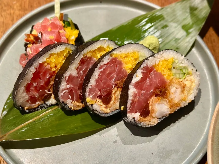 Meal spread with large futomaki