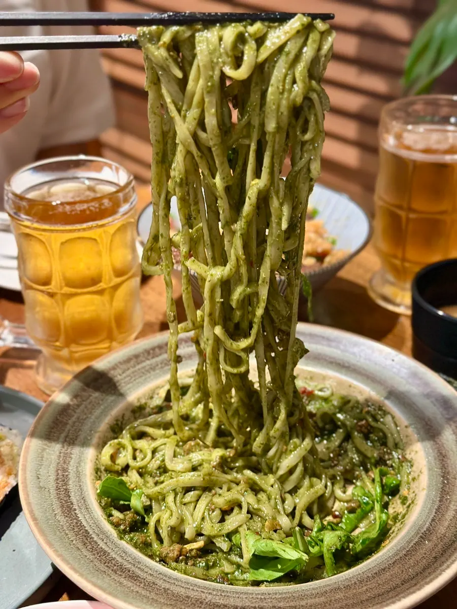 Basil soba topped with arugula
