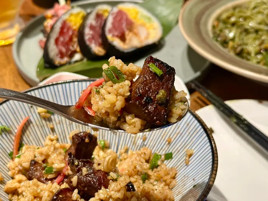 Steak rice bowl eaten with other dishes