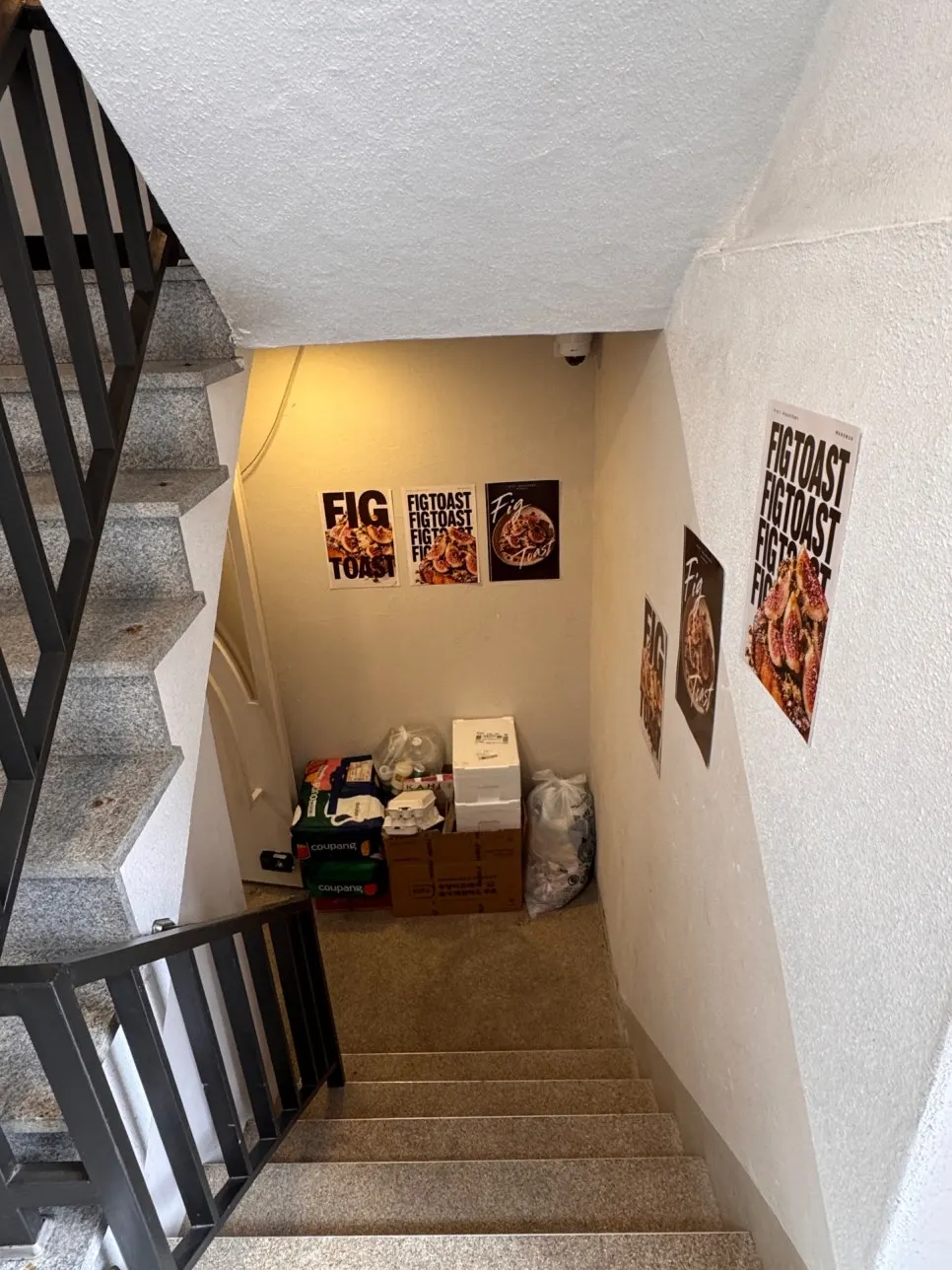 Stairs leading down to the semi-basement café entrance