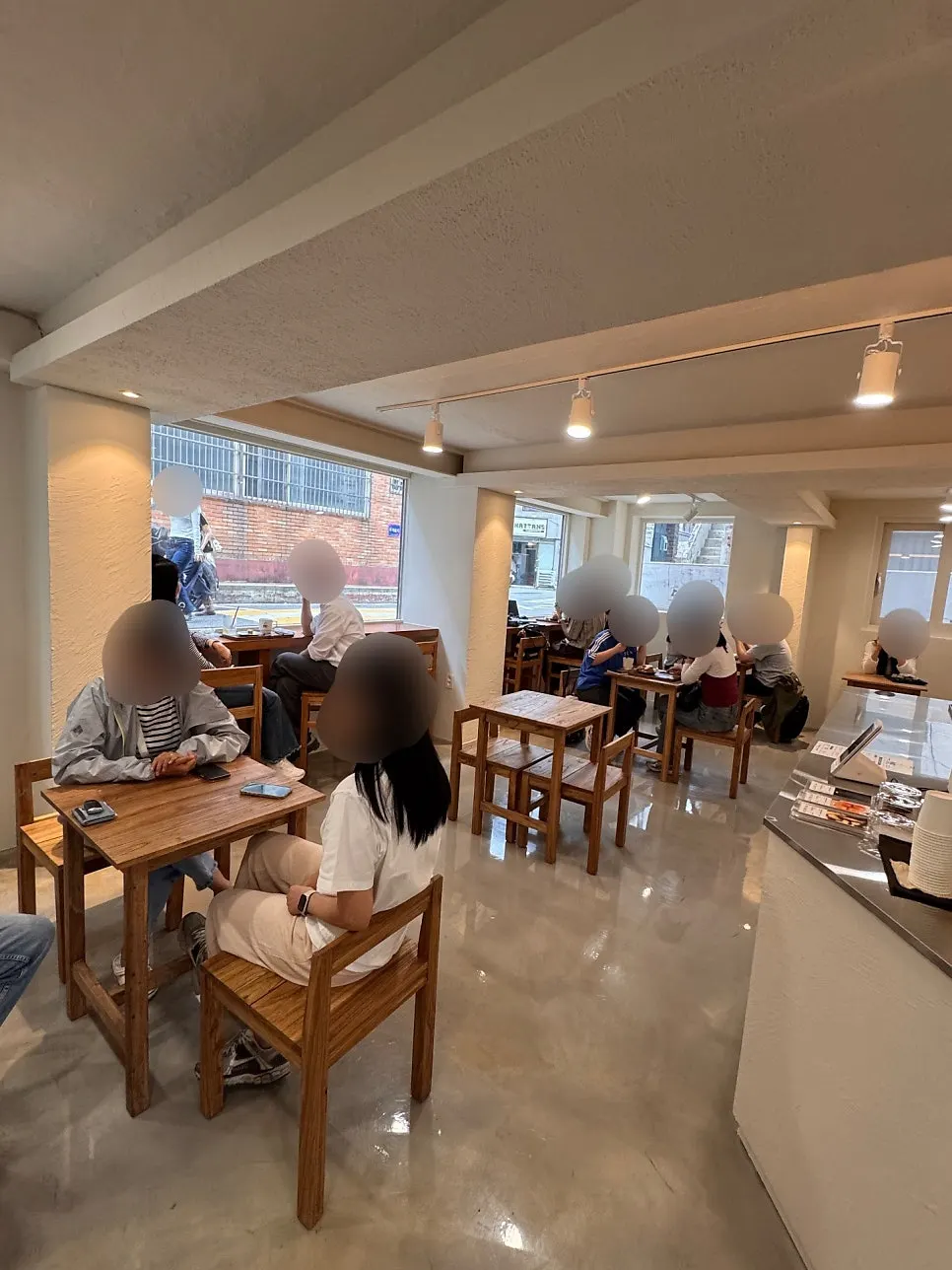 Café seating filled with customers right after lunchtime
