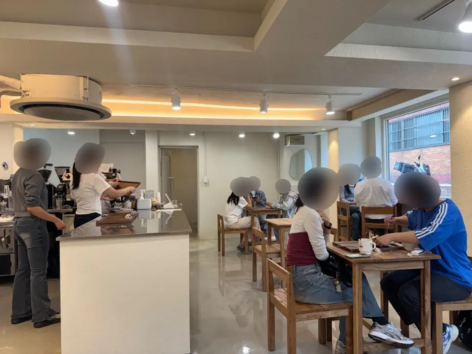 Horizontal view of the café hall lined with wooden tables