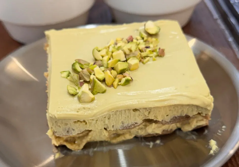 Close-up of tiramisu topped with crushed pistachio