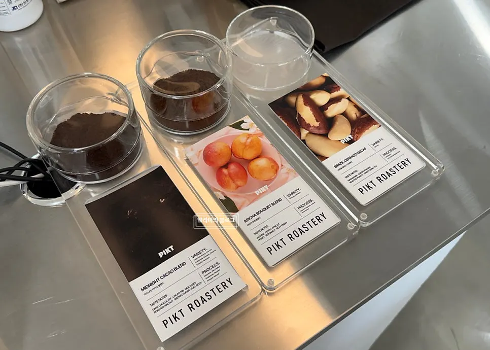 PICT Roastery menu board listing coffee, ade, and tea