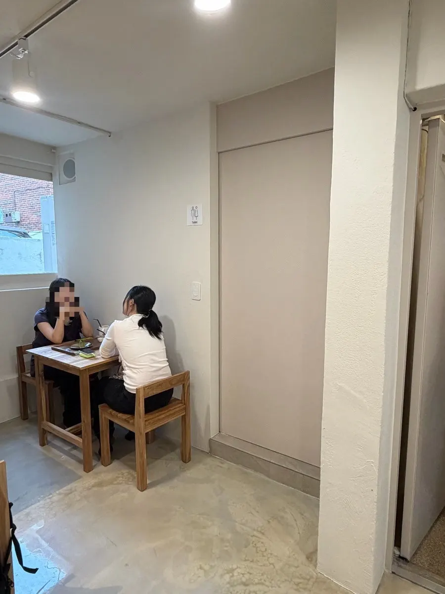 Interior of PICT Roastery Mangwon Branch with wood-tone decor