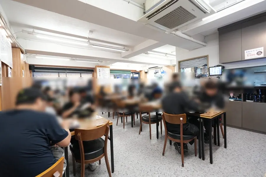 View of the spacious dining hall stretching to the back