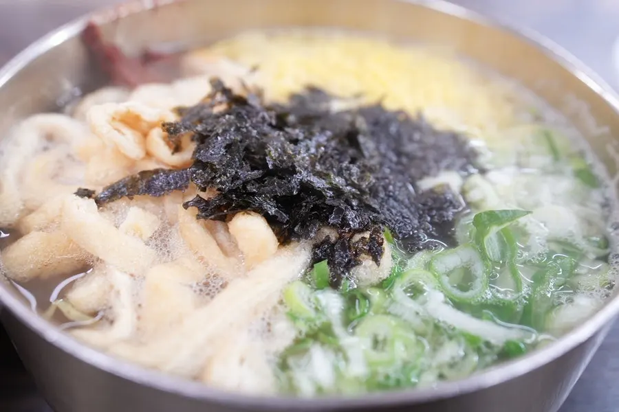 Bowl of anchovy kalguksu, ₩5,000 with bossam order