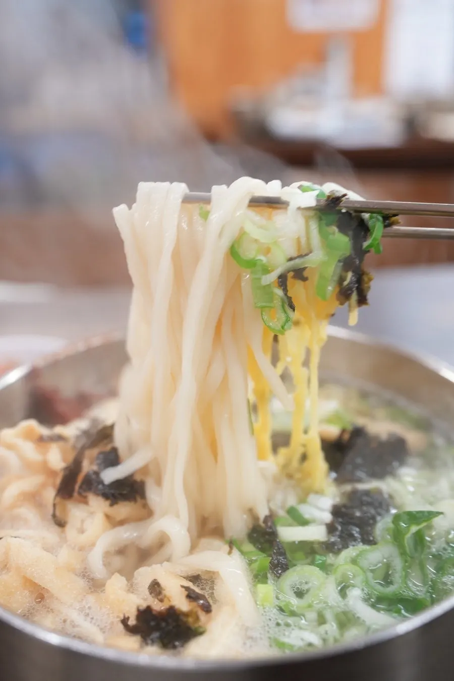 Noodles lifted up with chopsticks