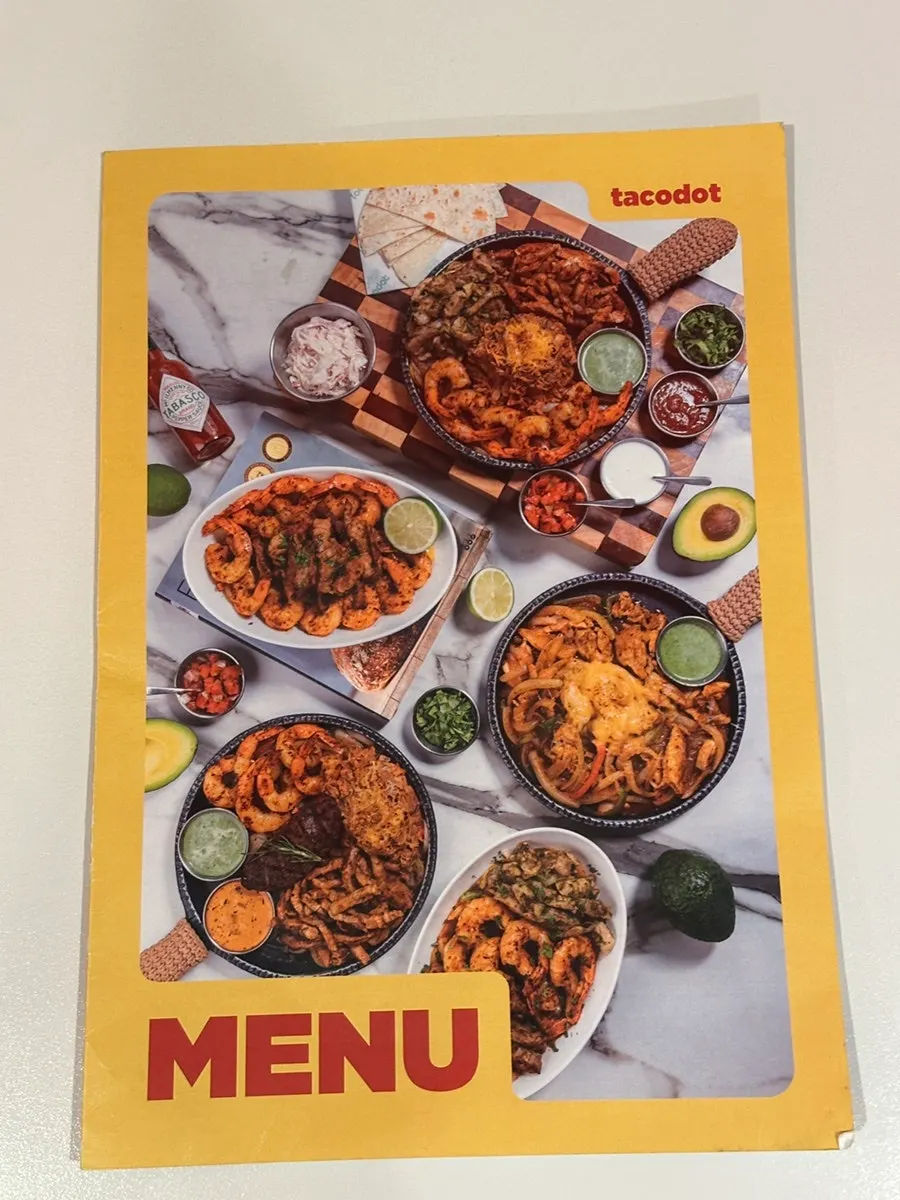 Self-serve bar with hot sauce at Taco Dot