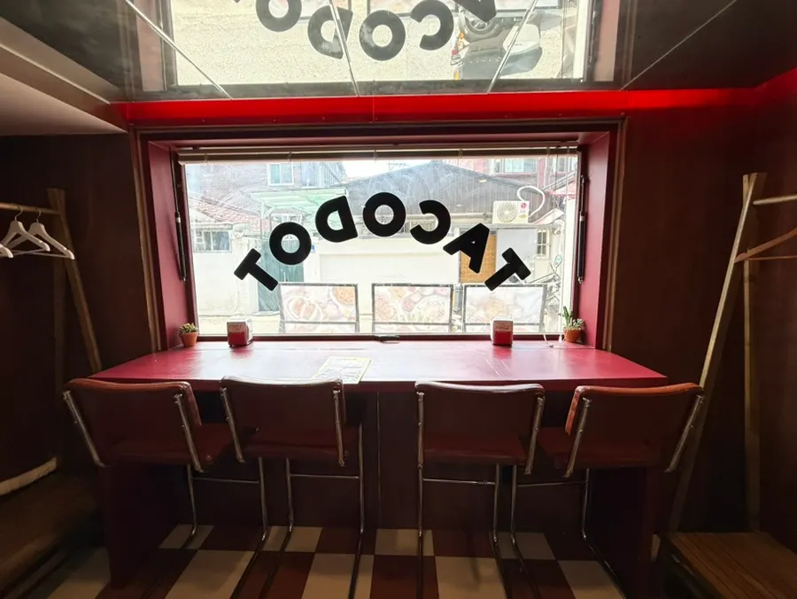 Seating and decor inside Taco Dot