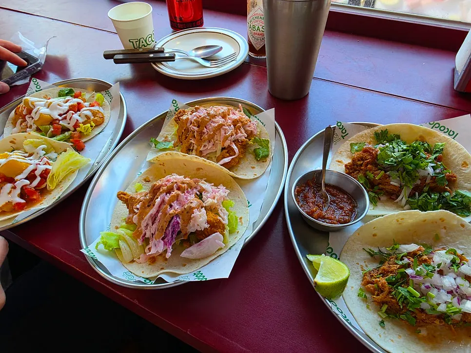 Full spread of Taco Dot tacos brought by staff