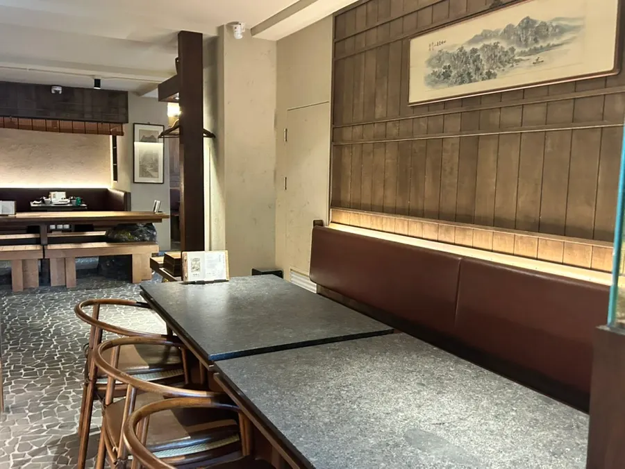 Semi-private seating at Manmok with generous spacing