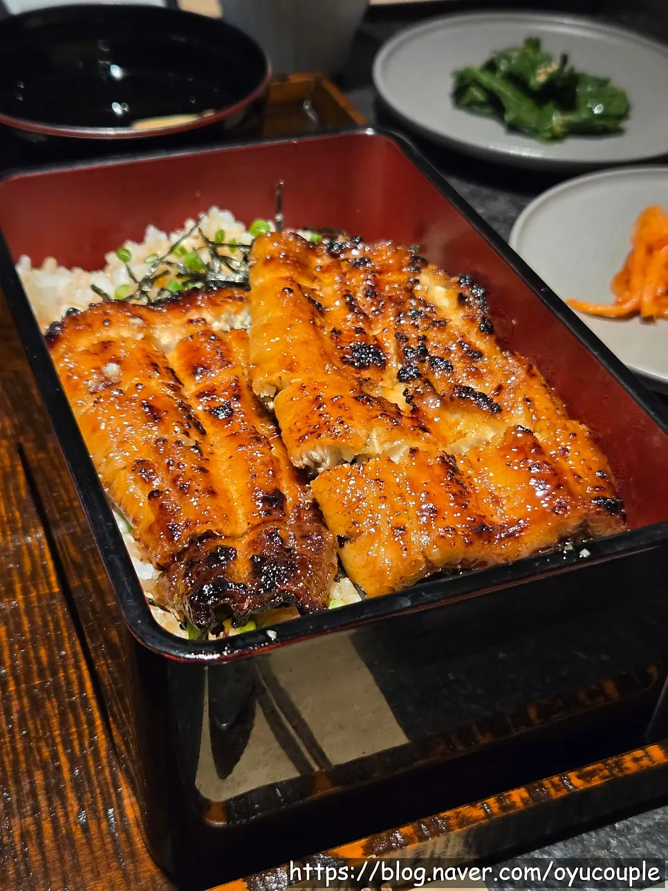 Dinner table setting with eel rice bowl and hanwoo nabe at Manmok