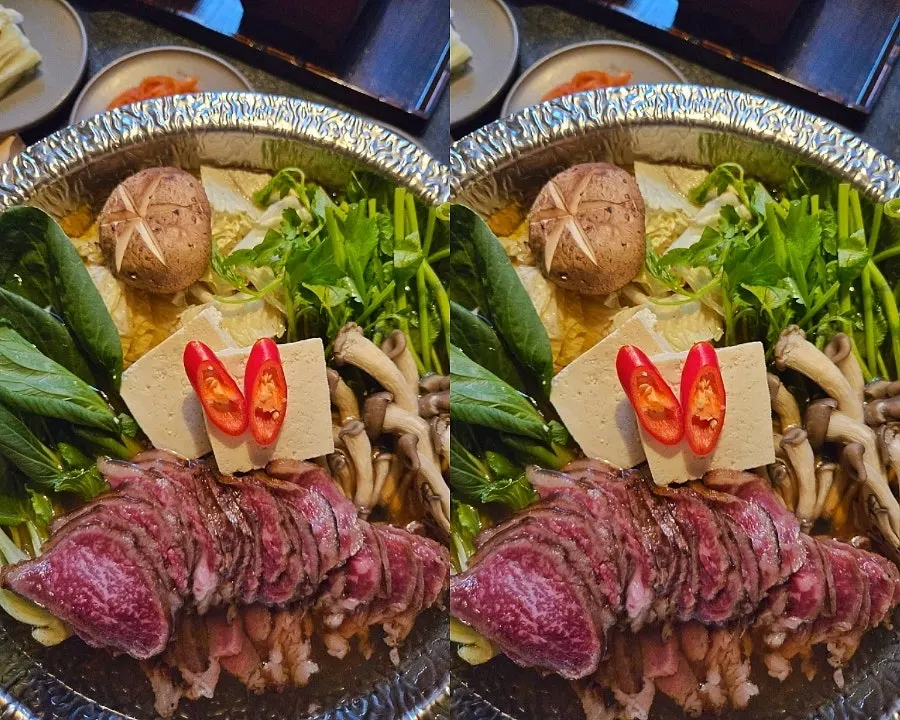 Table spread with half eel rice bowl and hanwoo hot pot