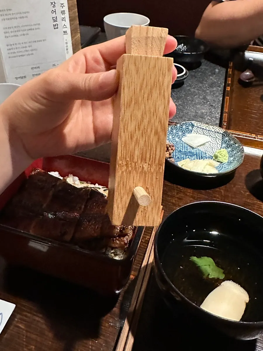 A bite of eel scooped up with rice