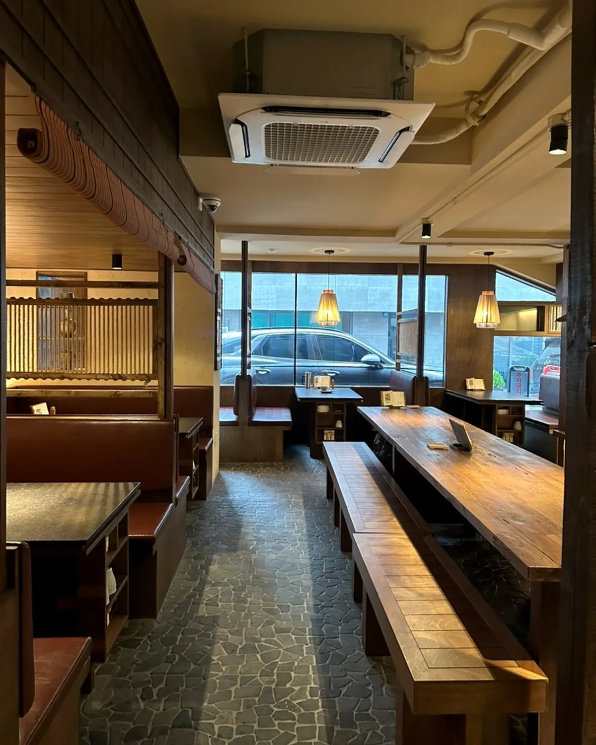 Table layout and lighting at Manmok Japanese restaurant
