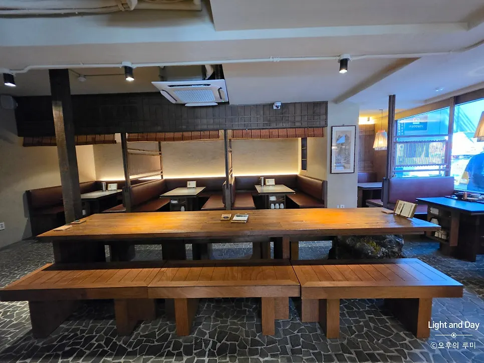 Manmok's interior decorated with calm lighting and wood