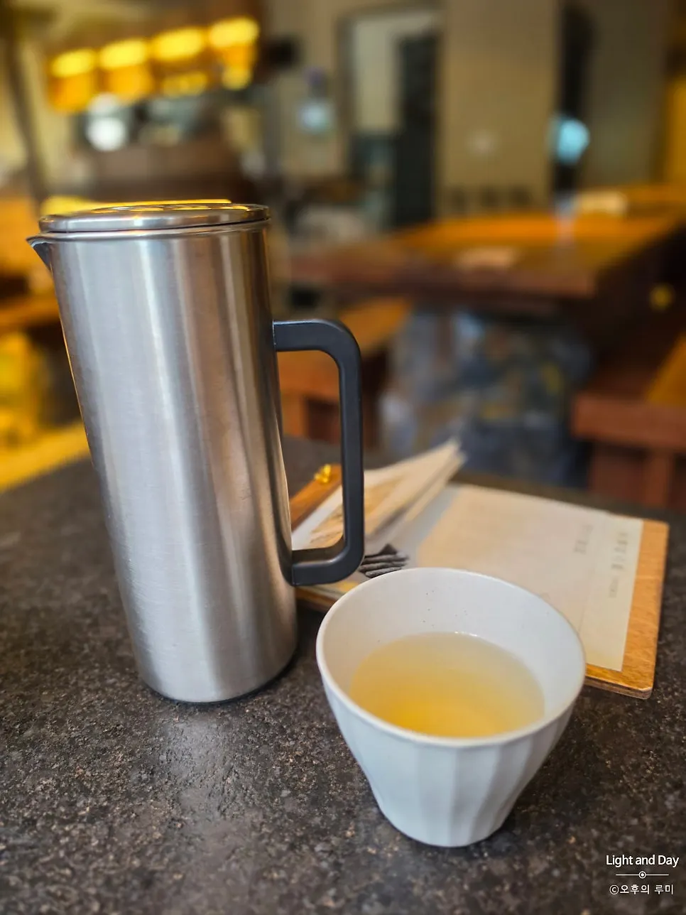 Menu and water set on the table at Manmok