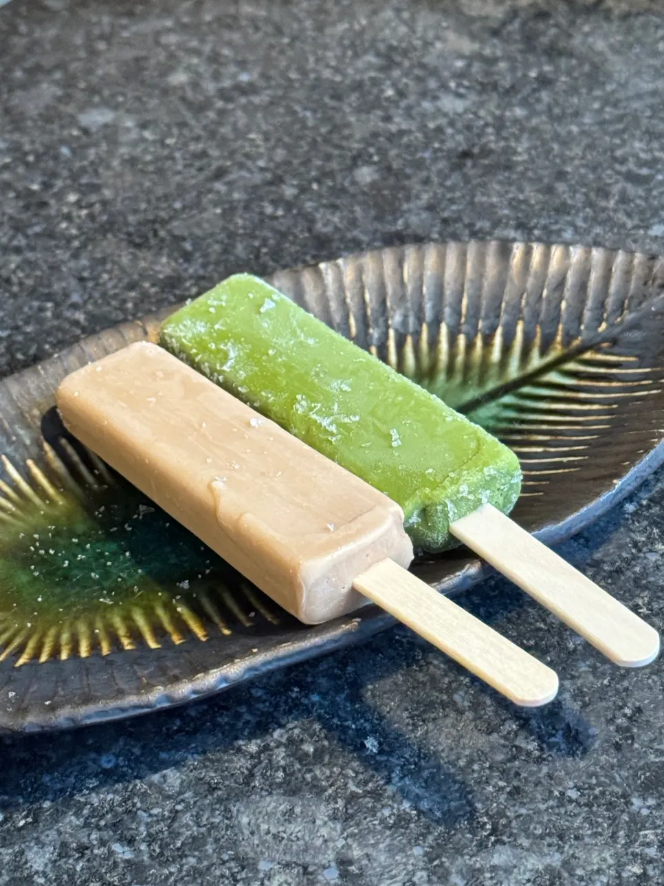 House-made ice cream bar served on a leaf-shaped ceramic plate