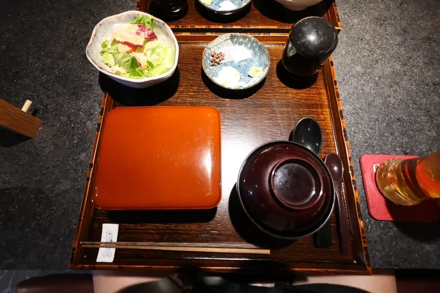 Side dishes accompanying Manmok's eel rice bowl spread