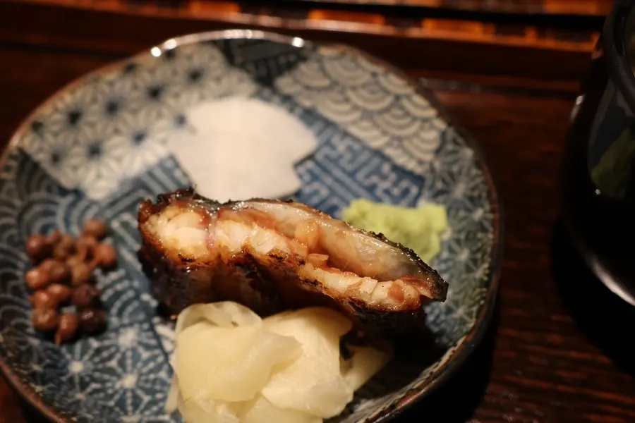 A piece of Manmok's eel infused with sauce
