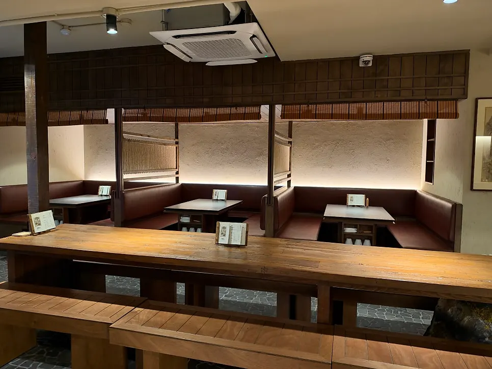 Interior view of Manmok with wood-toned decor
