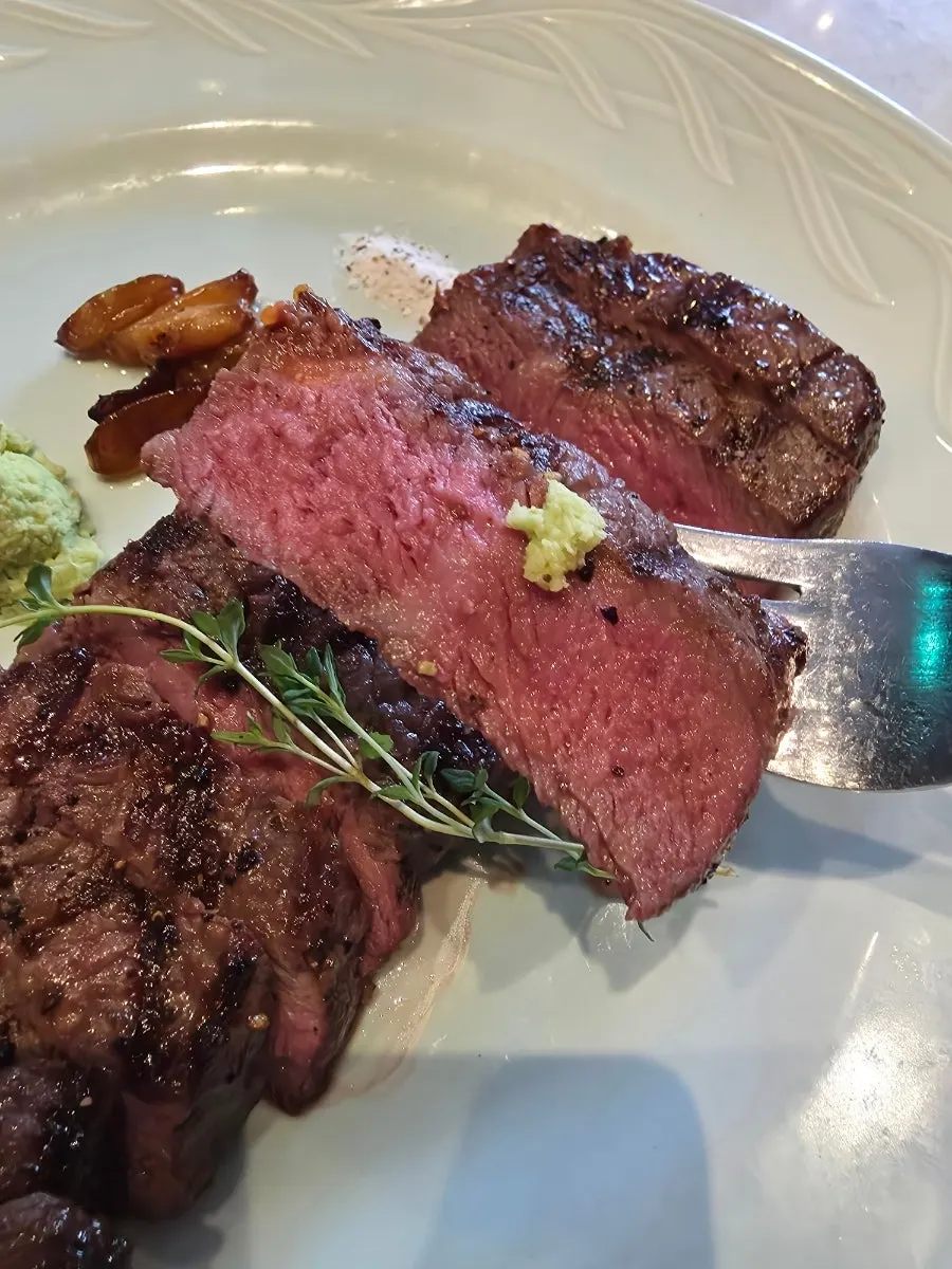 A piece of hanger steak dipped in salt