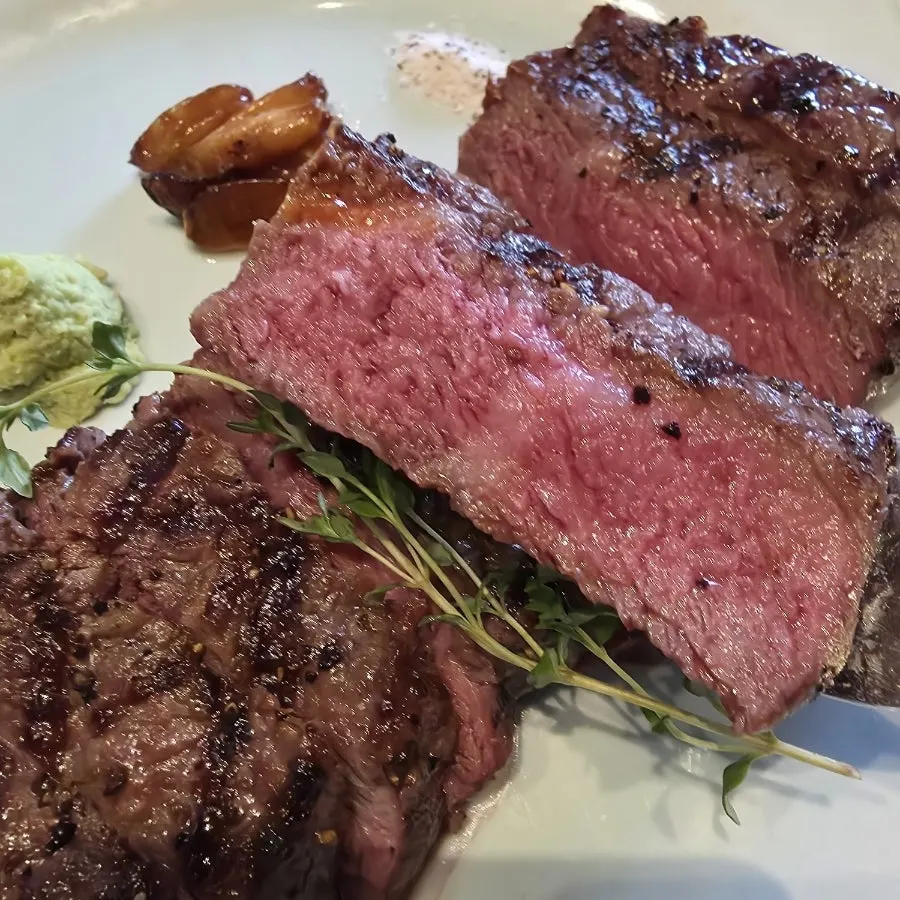 Table set with steak and side dishes