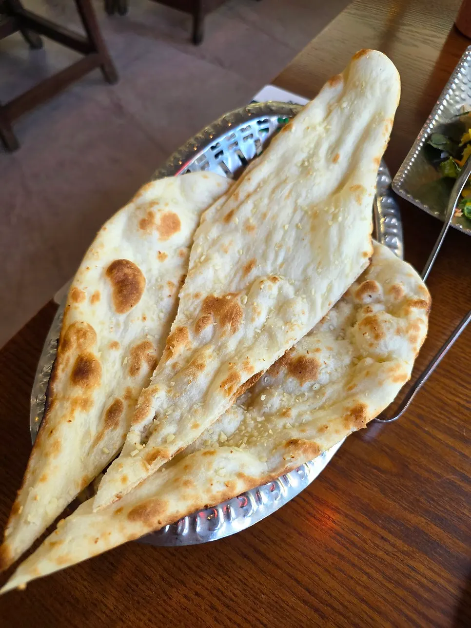 Set menu with garlic naan and curry placed together