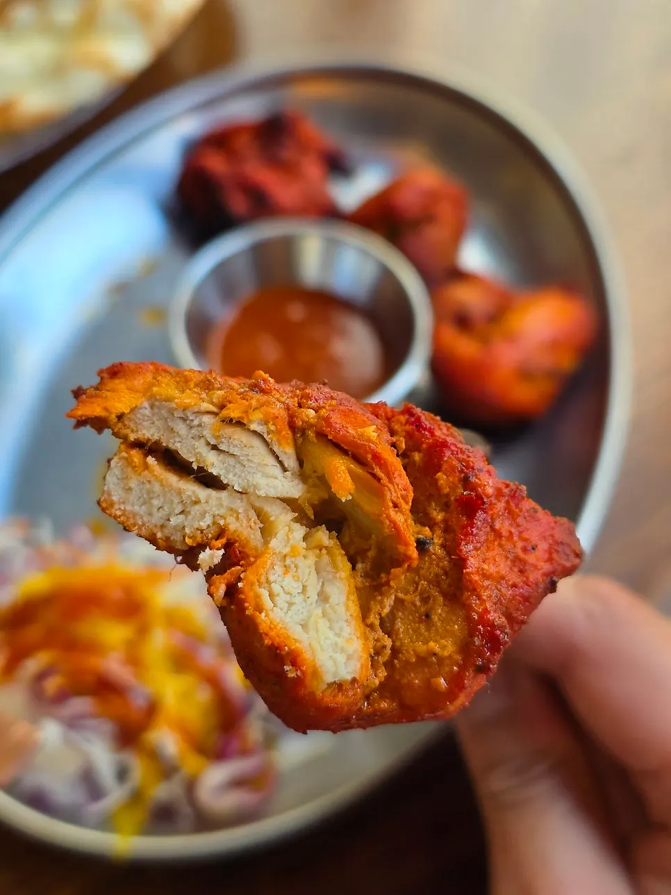 Plate of clay-oven grilled tandoori chicken