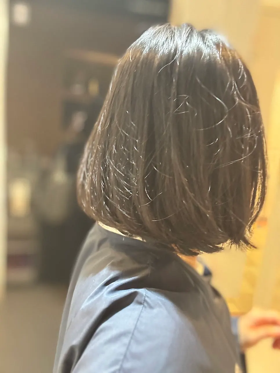 Side view of the long bob before the haircut