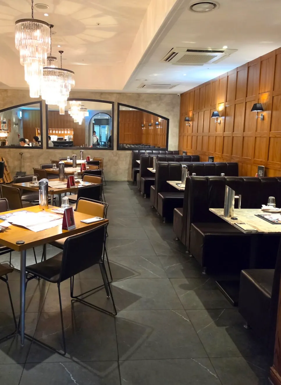 Interior with warm-toned tables and chairs