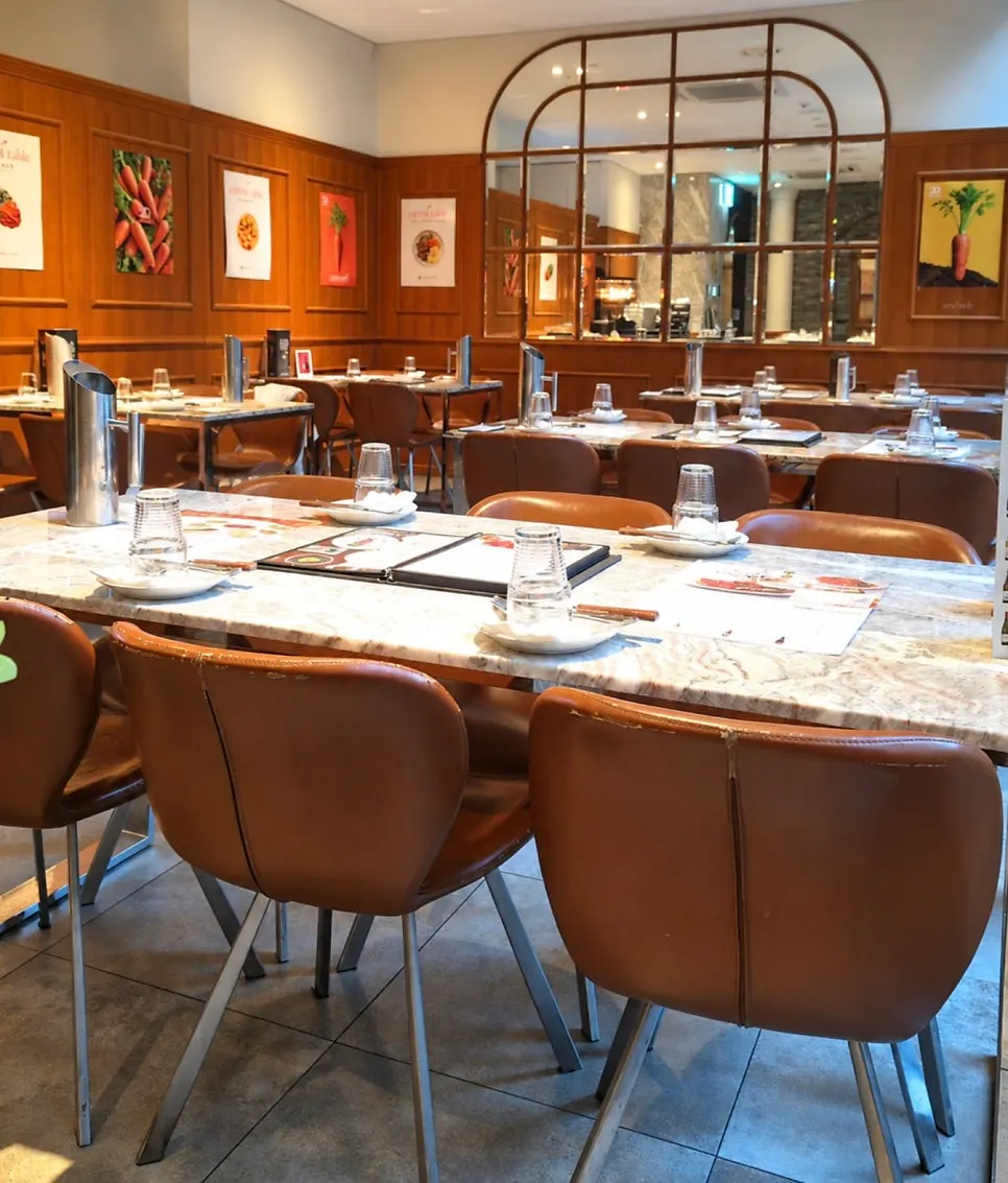 Dining hall with calm-toned walls and seating