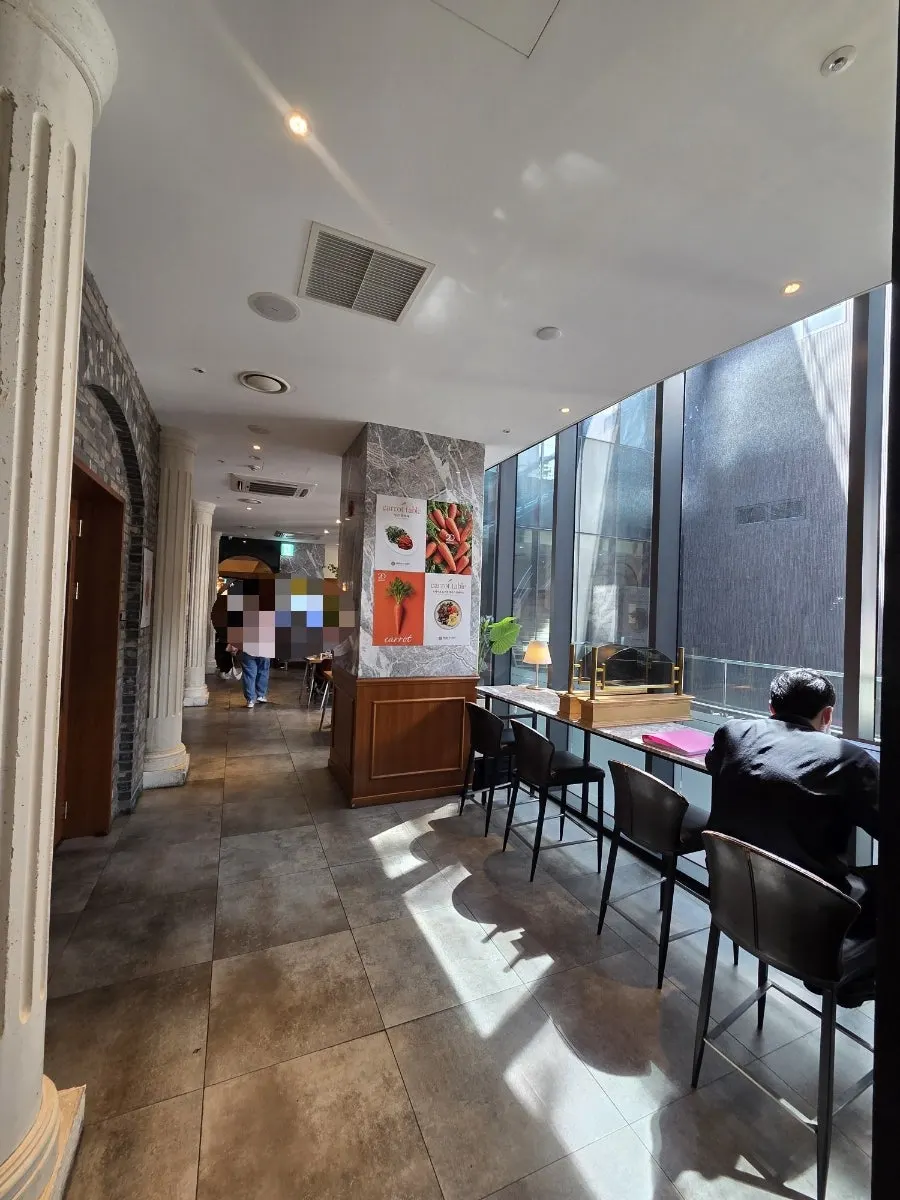 Vertical shot of the dining room under calm lighting
