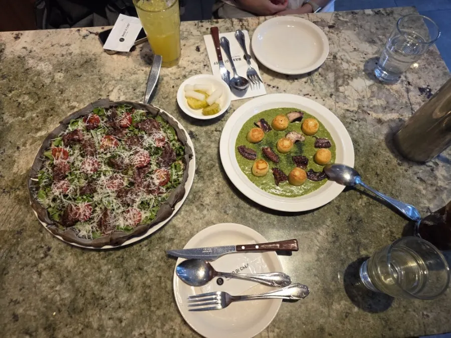 Table view with gnocchi and pizza placed together