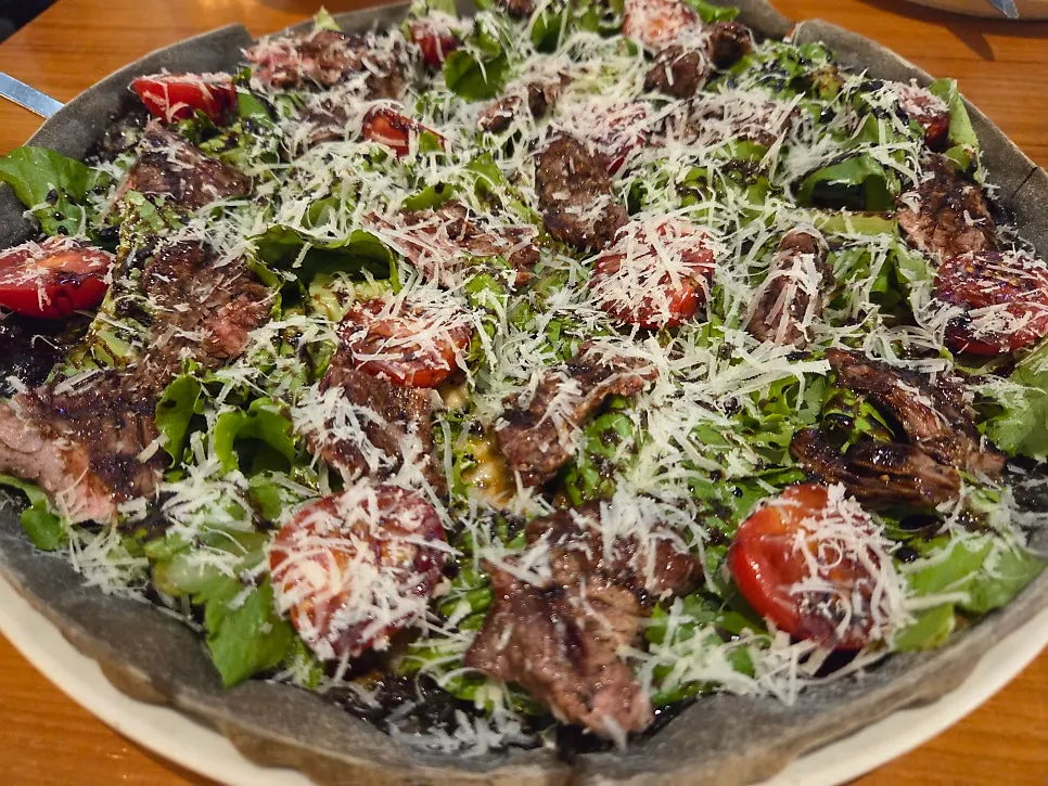 Full view of the black dough steak pizza