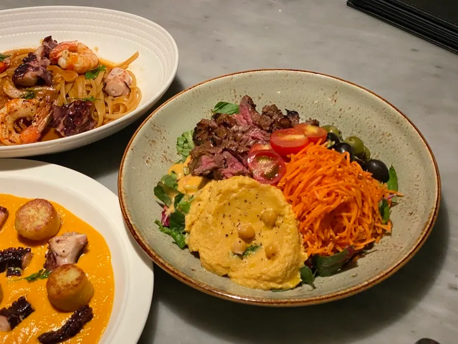 Full view of the steak & carrot hummus plate