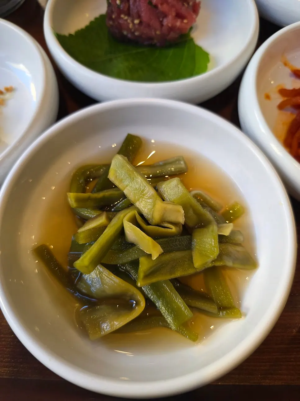 Sign for side dishes and free Hamhung naengmyeon