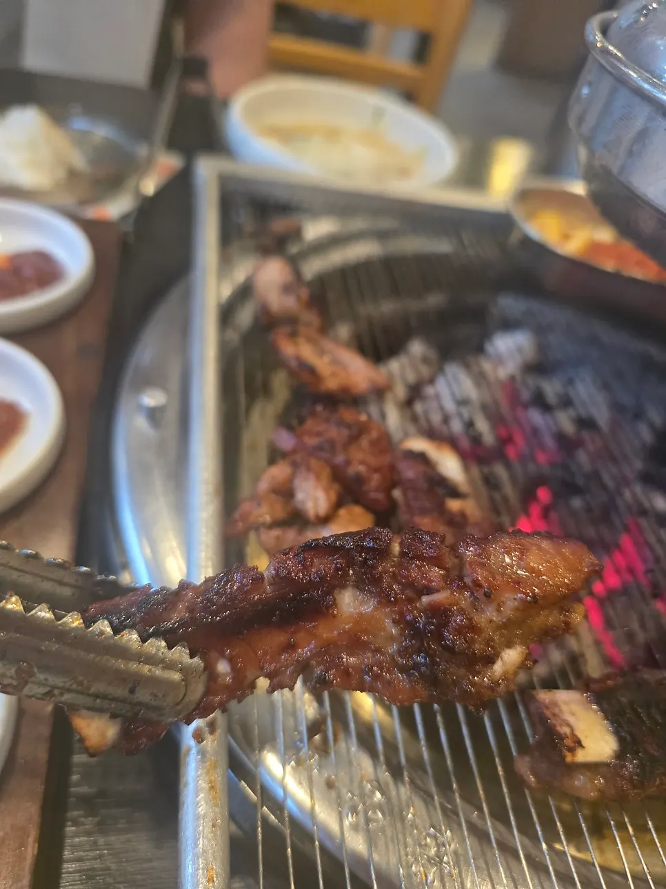 Manpo Galbi side dishes served on a wooden tray